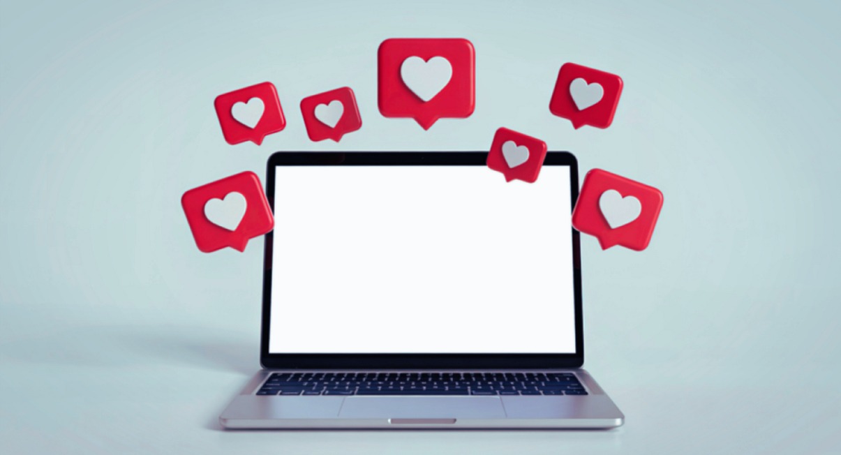Ordinateur portable avec notifications like symbolisant la gestion des réseaux sociaux et le Business Manager Meta